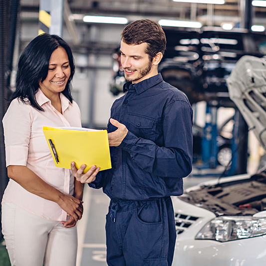 mechanic explaining how her deductible is covered