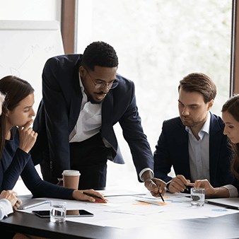 Manager leading a meeting with staff